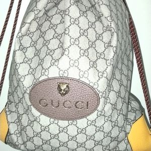 Gucci drawstring backpack with lionhead emblem